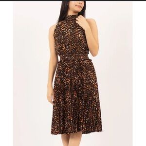 Nanette Lepore black with orange print woman’s pleated dress, high neck sz 16